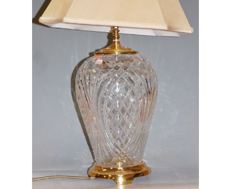 A Waterford cut crystal table lamp, having lacquered brass fittings and silk shade 