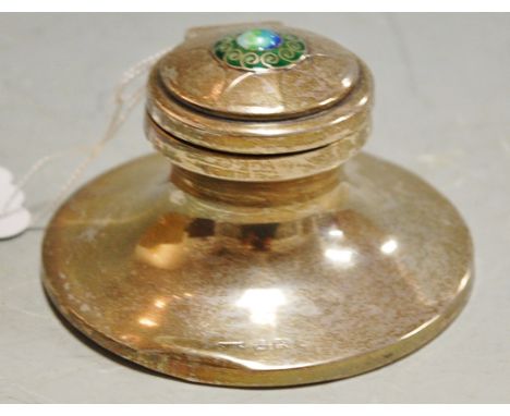 An early 20th century silver Arts & Crafts capstan inkwell, the hinge cover enamel set in the manner of Archibald Knox Condit
