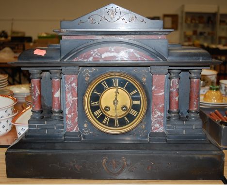 A late Victorian slate and marble mantel clock of architectural outline 