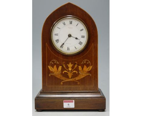 An Edwardian inlaid mahogany lancet topped mantel clock, having French brass eight day cylinder movement  Condition Report / 