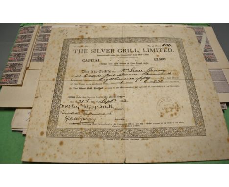 A folder of share certificates and early cheques