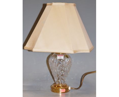 A Waterford cut crystal small table lamp with lacquered brass mounts and silk shade 