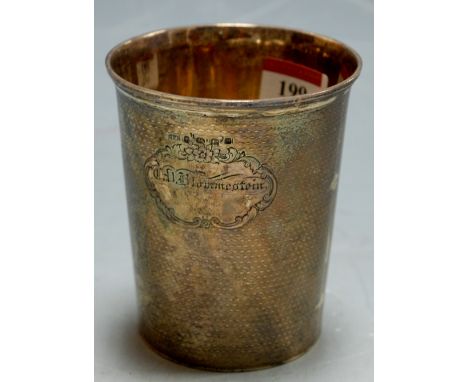 A Victorian silver beaker having engraved presentation cartouche and engine turned decoration 6.4oz