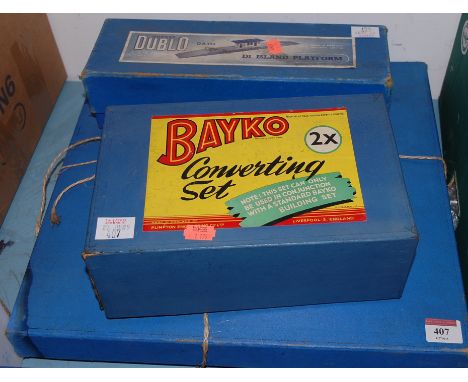 Two boxed Bayko converting sets; together with a Hornby Dublo D1 island platform, boxed (3)