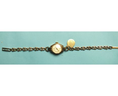 A lady's Eterna 9ct gold wrist watch, the case with inscription dated 1959, gross weight 15.8g, in Garrards box.