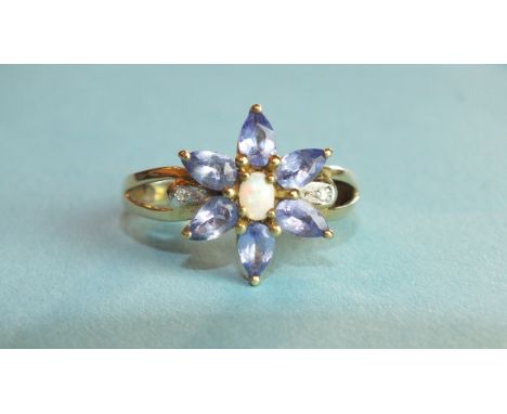 A tanzanite and opal cluster ring with diamond-point-set split shoulders and 10k gold mount, size N, 3.5g.