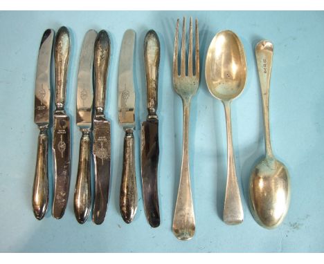 A Georgian Old English pattern table fork, London 1808, a pair of dessert spoons, London 1912 and six silver-handled butter k