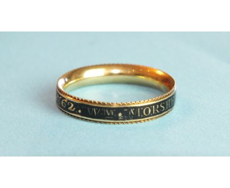 A Georgian gold mourning ring with black enamel reading Wm Morshead Esq Ob 30 Apr 1784 Ae62, tested as 18ct gold approximatel