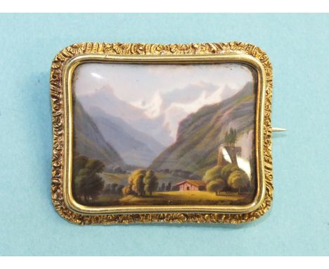 A 19th century Swiss enamel brooch, L'entrée de Louterbrun, the rectangular mountainous view within unmarked yellow metal mou