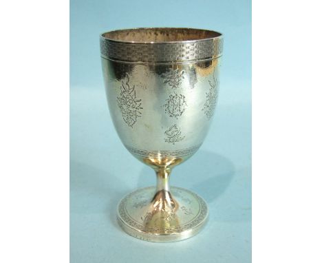 A Victorian silver and gilt goblet, with foliate engraving within woven borders, raised on circular foot, 12cm high, London 1