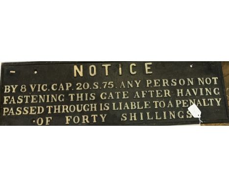 Two cast iron railway public notices, one reading "Notice - no one allowed to use his hoist except men in charge of material"