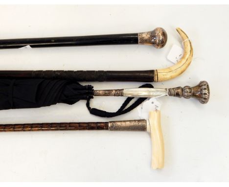 Lady's parasol with mother-of-pearl and white metal handle, marked 'sterling 925', an Edwardian malacca walking stick with si