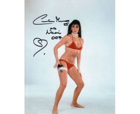 Blowout Sale! Caroline Munro super sexy hand signed 10x8 photo. This beautiful hand-signed photo depicts Caroline Munro who i