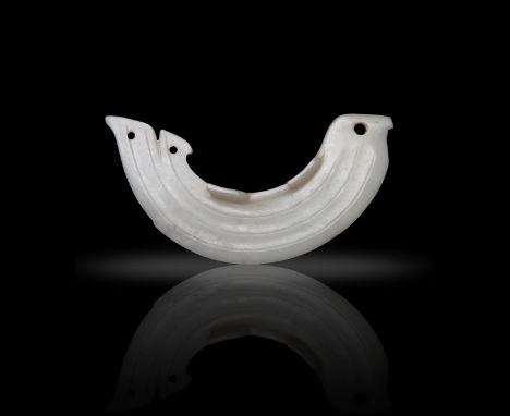 A WHITE JADE FISH PENDANT  商代或更晚 白玉魚  Shang Dynasty or later  The arched fish is carved with a flattened head and a pointed n