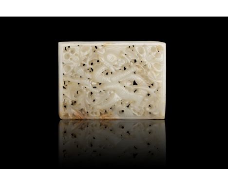 A RETICULATED CELADON AND RUSSET JADE ‘JAGON’ BELT PLAQUE  明代 白玉鏤雕穿花龍紋帶板  China, Ming dynasty  Size.5.8x7.9cm