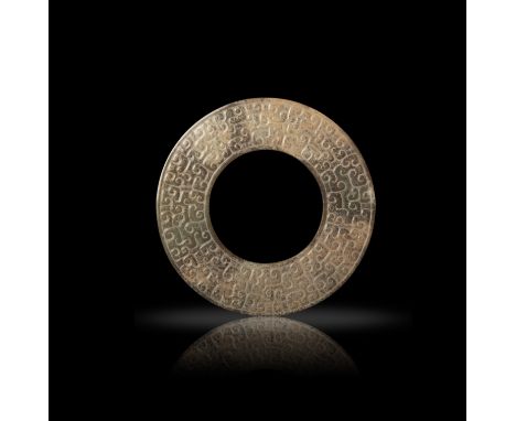 A CELADON JADE ‘PANHUI’ PATTERN DISC  春秋 青玉虺紋瑗  Spring and Autumn period  D: 10.3cm  PROVENANCE  Acquired in Hong Kong in the