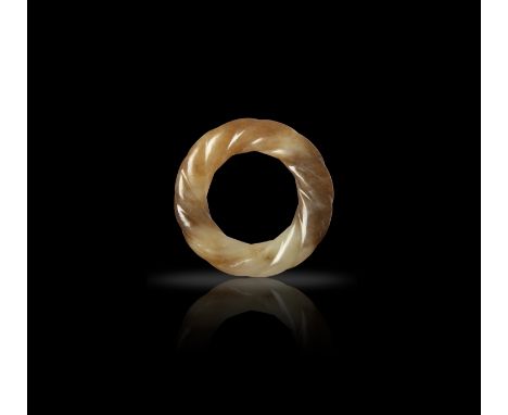A SMALL PALE CELADON AND RUSSET JADE RING  明代 青白玉絞絲紋環  China, Ming dynasty.  D: 4.6cm