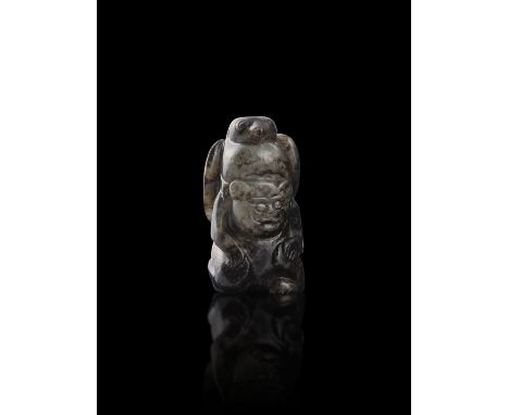 A BLACK AND WHITE JADE ‘BEAR AND EAGLE HERO’ PENDANT  清代 黑白玉英雄玉墜  China, Qing dynasty  A squatting bear with an eagle draped 