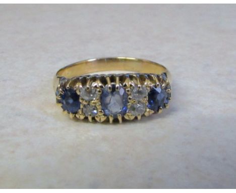 Tested as 18ct gold diamond and sapphire ring size K/L (total weight 3.7g)