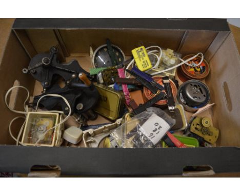 Various watchmakers tools, clock parts and wristwatch straps