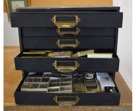 Watchmakers cabinet full of parts, pocket watches, movements, tools etc