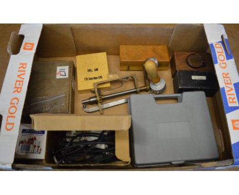Various watchmakers tools including a spring winder, drill bits etc