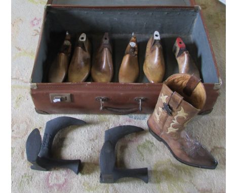 Suitcase containing shop display ceramic cowboy boot, cobbler's lasts etc
