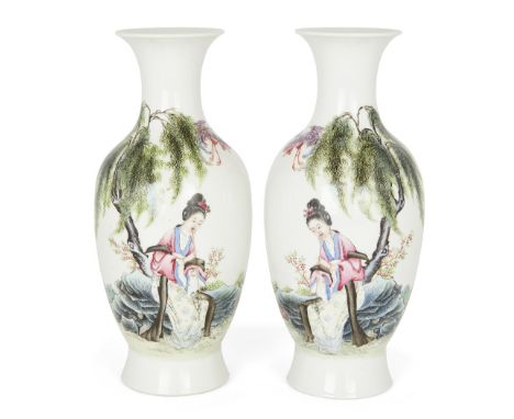 A pair of Chinese famille rose 'ladies' vases, 20th century, painted in famille rose enamel to each vase with a lady in long 