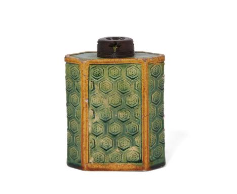 A Chinese biscuit porcelain green and yellow-enamelled tea caddy, Kangxi period, the exterior decorated with an incised honey