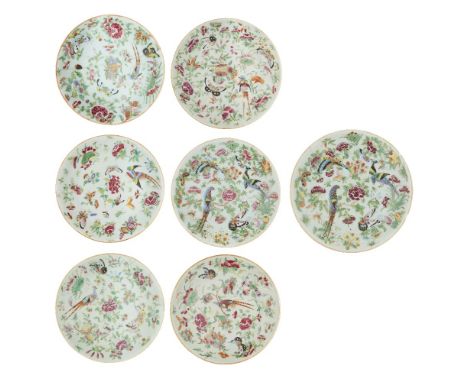 Seven Chinese famille rose and celadon-glazed 'phoenix' plates, 19th century, each shallow dish standing on a short foot with