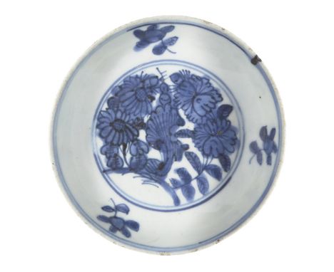 A Chinese blue and white porcelain 'flowers' dish, Wanli period, painted to the interior with bunches of chrysanthemums and p