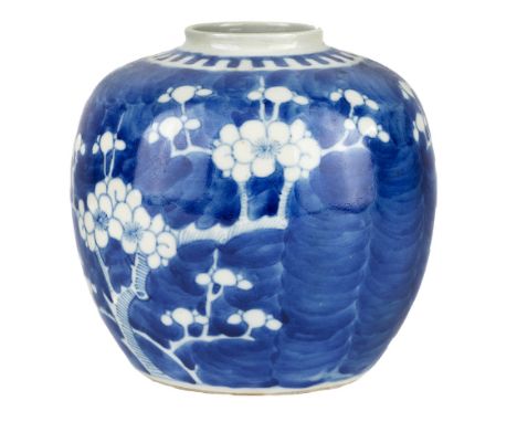 A Chinese miniature blue and white 'prunus' jar, 19th century, painted with blossoming prunus branches on a deep blue ground,