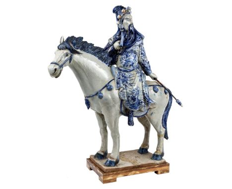 A large Chinese blue and white 'Guangong' statue, 20th century, with Guangong, one of the main characters in Romance of Three