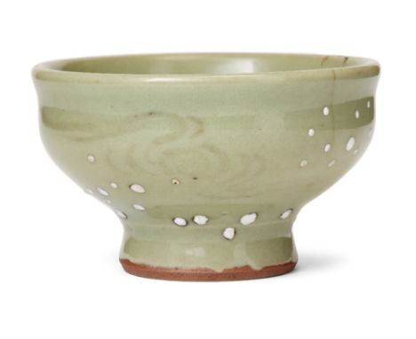 A Chinese stoneware Longquan celadon-glazed cup, 15th century, impressed to the central reserve with an archaic character ins