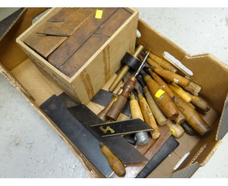 A box of various vintage woodworking tools including chisels, set squares, old moul planes etc