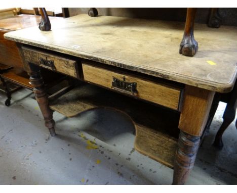 A vintage oak two-drawer wash stand with lower shelf