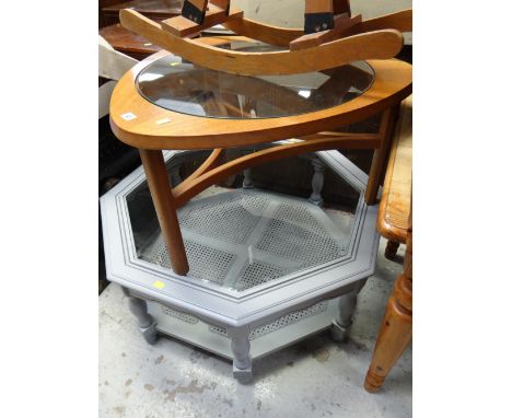 A G-Plan style teak circular glass top coffee table together with a painted grey octagonal glass top coffee table with a rush