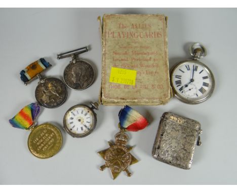Four WWI medals relating to Lance Corporal M Roberts together with allied playing cards, two pocket watches & a silver vesta 