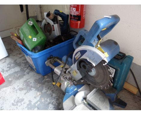 A parcel of electrical tools including a chop saw, Makita drill, circular saw etc E/T