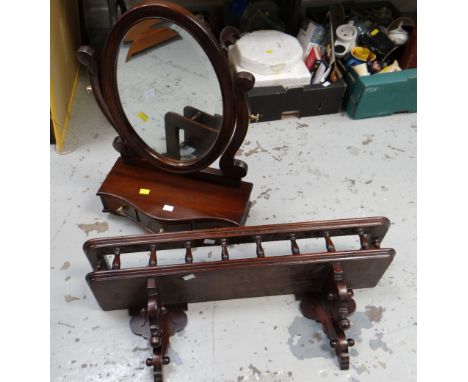 A modern mahogany toilet mirror together with a darkwood ornate wall shelf
