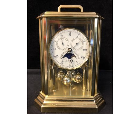 A Sewells New Millenium 200th Anniversary Clock, with secondary dials for moon phase, date and day, quartz movement, brass fi