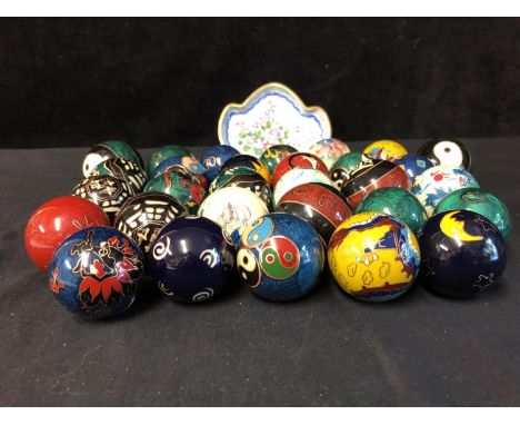 A collection of Chinese cloisonne and painted chiming health balls, variously decorated;  and a Chinese enamel pin dish (qty)