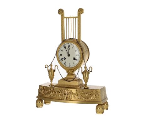 French Empire ormolu two train mantel clock with silk suspension striking on a bell, 3" circular dial, the movement stamped 4