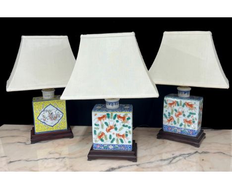 Pair of Chinese porcelain rectangular table lamps with shades, decorated with fish, 16" overall; together with a similar yell