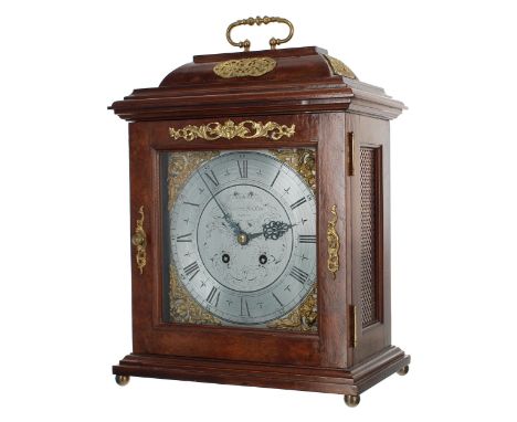 Georgian style walnut and brass mounted two train bracket clock, the 8.5" silvered foliate engraved dial with brass corner sp