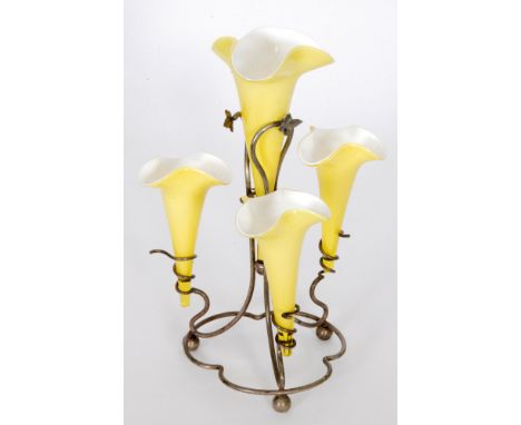 An early 20th Century John Walsh Walsh glass epergne, the white metal stand of trefoil form with three scrolled branches surr