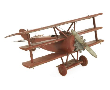 A PAINTED METAL WW1 TRIPLANE MODELmid-20th century, with external prop and engine,nose to tail 97cm wingspan 109cm
