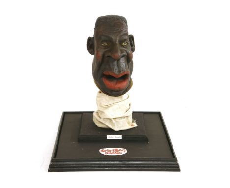 ROBERT MUGABE,1980/90s, an original Spitting Image puppet head of Robert Mugabe, mounted in a glass case,case 47 x 19cm
