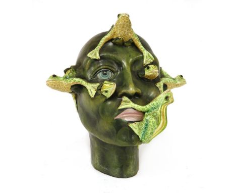 MACIAS HEAD (BARCELONA),1960s, Italian, a ceramic head with frogs bursting from the skin and eyes, in the style of Lenci and 