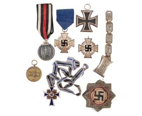 A COLLECTION OF THIRD REICH BADGES AND MEDALS Original Iron Cross 2nd Class maker marked on the ring '24'Original German Cros